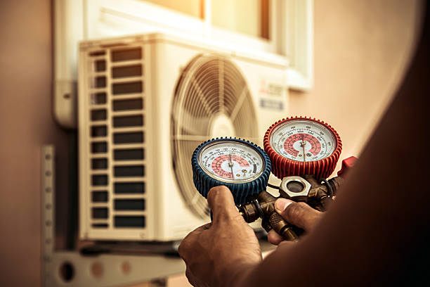 Professional Air Conditioning Service technician working in North Dighton, MA